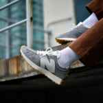 person wearing gray sneakers